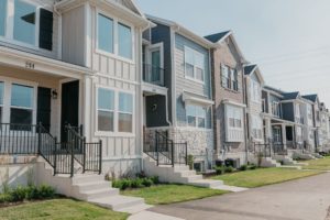 row of lakefront townhomes by EDGEhomes